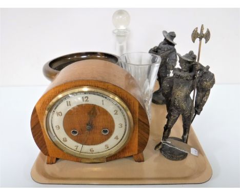 A tray of walnut mantel clock, wooden comport, glass decanter, pair of spelter metal figures "Cavaliers" 