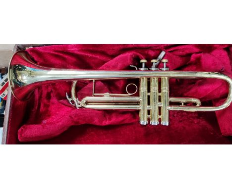 An American Conn cased brass trumpet with mother of pearl inlaid buttons No. K96203 