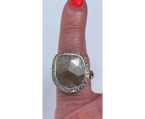 By William Welstead, English jewellery designer, an 18 carat hallmarked white gold ring set with large flat asymmetrical diam