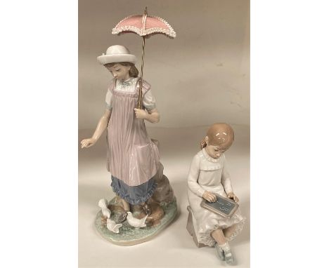 A Lladro figure of a girl with a parasol feeding birds 5150, height 32cm &amp; a Nao girl writing.