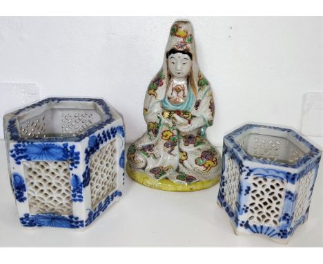 A Japanese ceramic figure of a seated scholar with scroll and two blue and white pierced vases All 3 pieces in good condition