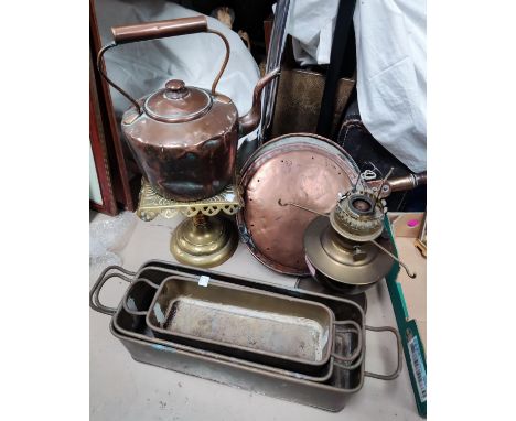 A 19th century copper kettle, brass trivet and oil lamp, a copper pan and 3 graduating brass planters 