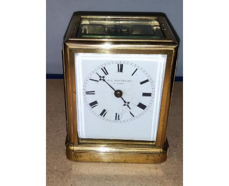 A 19th century French carriage clock by F .L. Hansbury of Paris, four glass bevelled sides and a brass back, height 13 cm, de