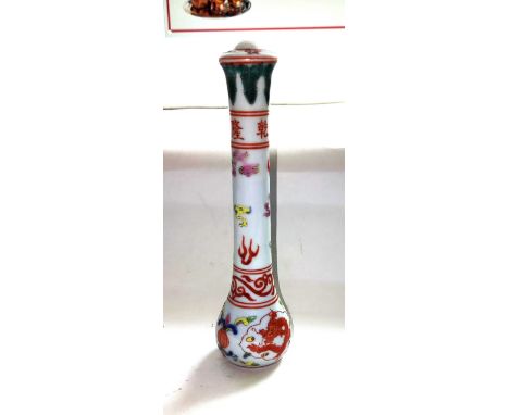 A Chinese ceramic scholars brush handle decorated with dragons etc