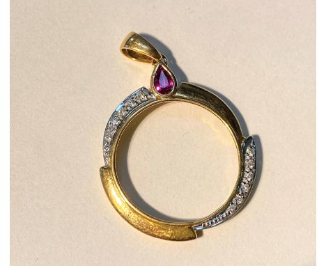 A yellow metal circular pendant set with tear drop ruby coloured stones and diamond chips, stamped 750, 18ct 4.6gms 