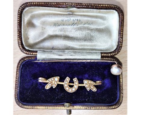 A yellow metal horseshoe brooch set seed pearls; a yellow metal pearl set stick pin, 2.8 gm 