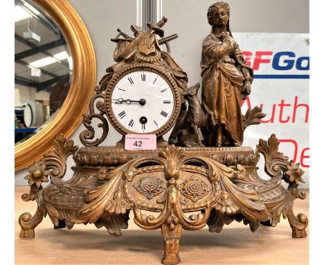A 19th century French mantel clock in gilt case, decorated with shepherdess, white enamel dial 