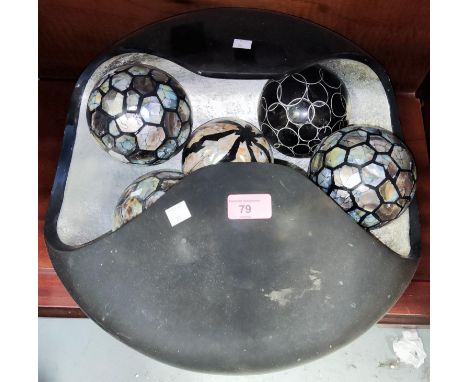 A contemporary lacquer work bowl containing 6 heavy mother of pearl inlaid boules, 44cm wide 
