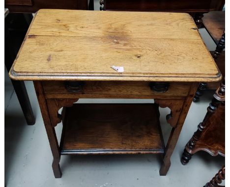 An Edwardian light oak side table of 2 tiers with frieze drawer and undershelf 
