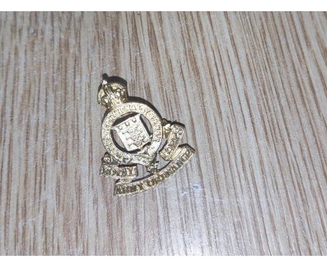 ROYAL ARMY ORDNANCE CORPS, a 9ct gold badge (base metal pin) 6.13gm gross 