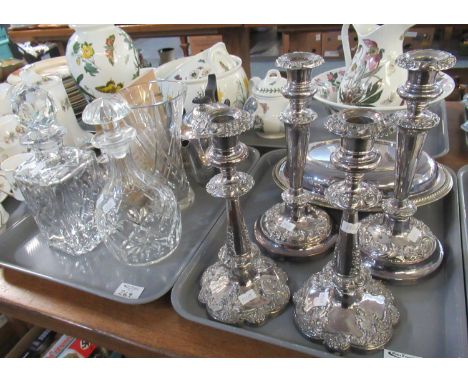 Two trays of assorted items to include: two pairs of white metal candlesticks embossed with flowers, plumes, etc. White metal