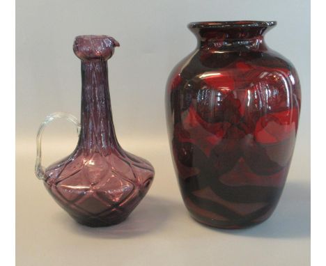 Two modern art glass items to include amethyst coloured single-handled ewer and a ruby glass baluster vase. (2)(B.P. 21% + VA