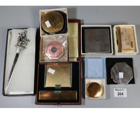 Collection of engine turned and other vintage compacts, some with enamel decoration, together with a letter opener with rifle