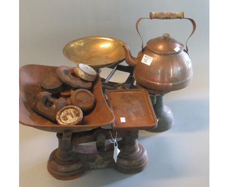 Two vintage cast iron scales with weights, together with a copper kettle. (B.P. 21% + VAT)Appears to be  working and moving u