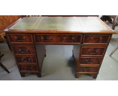 Reproduction mahogany knee hole desk, the leather inset top above three drawers to each pedestal on bracket feet.(B.P. 21% + 