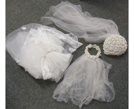 Three wedding veils, one very long white net and lace wedding veil with comb, adorned with white flowers and diamante, togeth