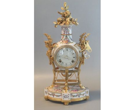 Reproduction French design gilt metal and porcelain two-train balloon-shaped mantel clock. 42cm high approx.(B.P. 21% + VAT) 