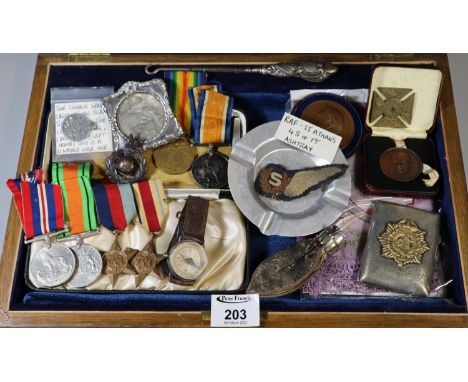 Wooden box of military interest to include medal groups from WWI & WWII, silver frame with black and white picture of a soldi