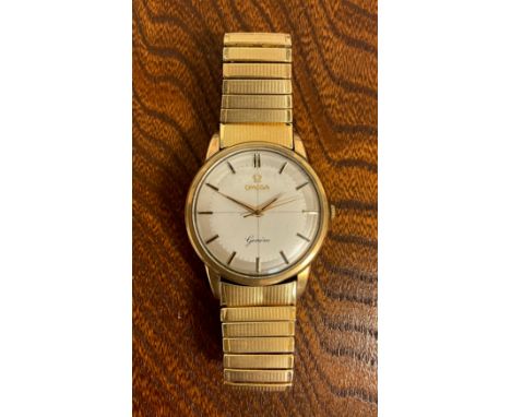 Omega  - a Geneve 9ct gold cased wristwatch, 34mm diameter case, silver target dial, block baton markers, centre seconds, man