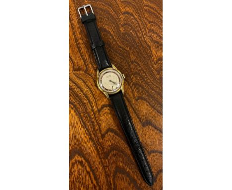 A 1940s Record rolled gold cased wristwatch, stepped lug case, two town copper and cream dial, Roman numerals and dot markers