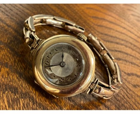 Rolex - a vintage 9ct gold cased wristwatch, 26mm diameter case, silvered dial, black Arabic numerals, spade hands, 15 jewel 