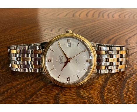 Omega - a stainless steel and gold Automatic Calendar Centre Seconds Wristwatch, 36mm diameter case, textured silver dial sig