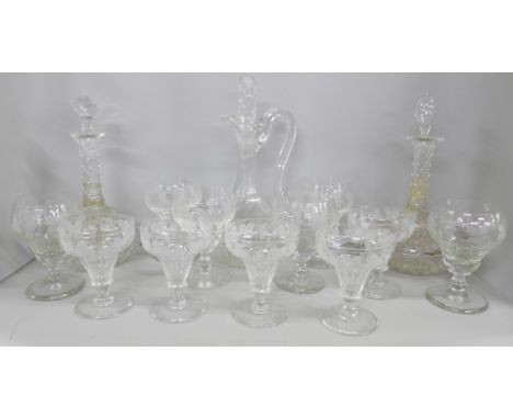 Glass; a set of six 19th century grape and vine wine glasses, five champagne glasses and a pair of decanters and claret jug w