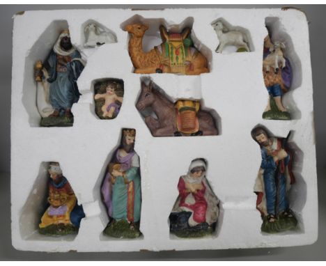A vintage porcelain Nativity set with 11 piece hand painted porcelain. In original box. 