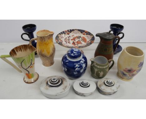 A large collection of china including two teapots, plates, teacups and saucers, cake stand, Sylvac jug, other jugs and vases,