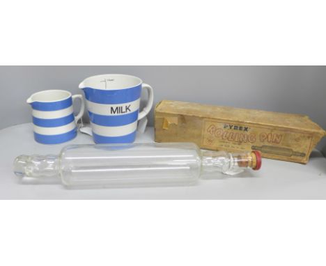 A T.G. Green 'milk' jug and one other jug and a Pyrex glass rolling pin 