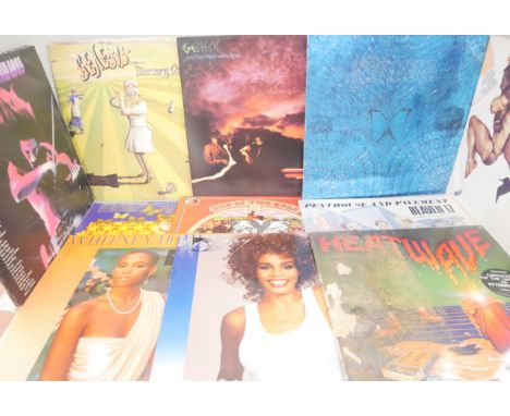 Twenty LP vinyl records and 12" singles, pop and rock including Frankie Goes to Hollywood, Genesis, Jimi Hendrix, Status Quo,