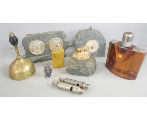 A leather covered hip flask, a granite table lighter, barometer and weather station, two Police whistles including Metropolit