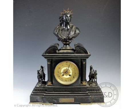 A Victorian slate and bronze figural mantle clock, with Arabic dial and eight day movement striking on a gong, the clock surm