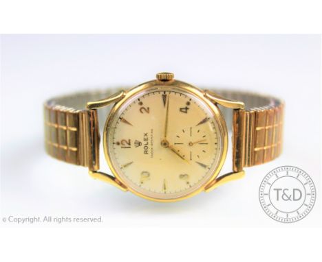 A gentlemans 9ct gold Rolex wristwatch 1950's, the champagne dial with gilt numerals 12, 2, 4, 8 and 10 and batons, subsidiar