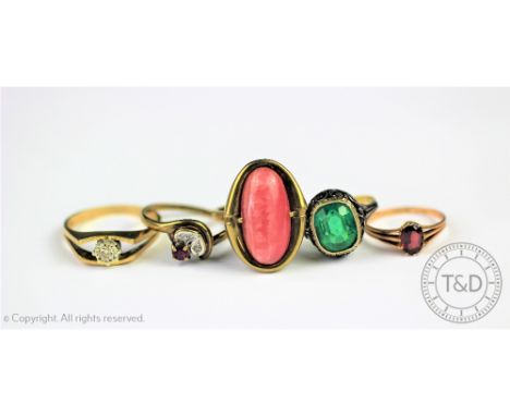 A collection of five rings, comprising; a garnet set ring, a paste set Georgian style ring in yellow and white metal intricat
