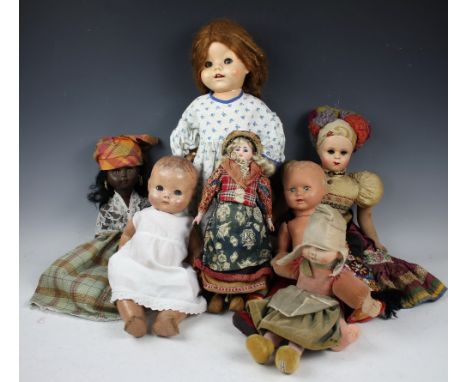 A selection of nine assorted dolls to include a Norah Wellings felt example, 33cm high, a 1234 3DEP German bisque headed doll