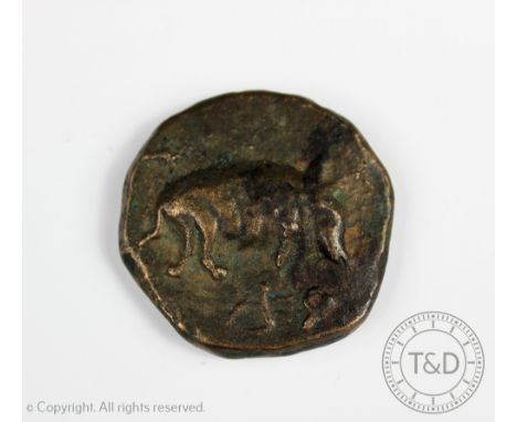 A large Greek or Republican Roman bronze coin, one side decorated with a boar, the other side with an animals head, 5.5cm