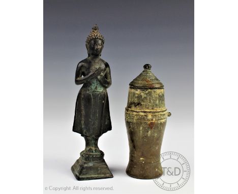 A Thai/Laos bronze figure of a female deity, modelled standing upon a lotus crown base, 16cm high and a bronze vessel/opium p