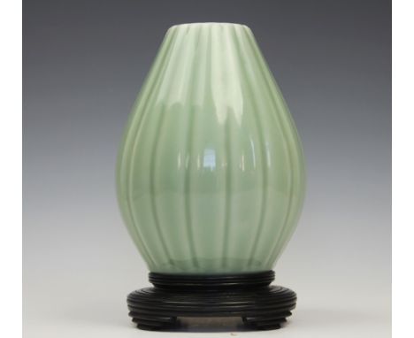 A Chinese celadon vase, Yongzheng seal mark, the vase of lobed ovoid form decorated throughout with an allover glaze, with an