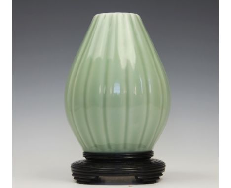 A Chinese celadon vase, Yongzheng seal mark, the vase of lobed ovoid form decorated throughout with an allover glaze, with an