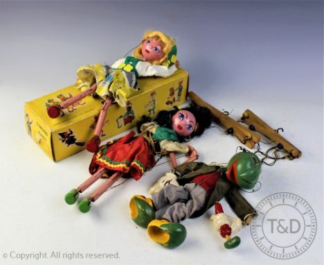 A Jiminy Cricket puppet, possibly Pelham puppet, with another puppet of a girl and a boxed Pelham Tyrolean girl puppet (3) (a
