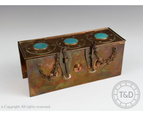 An Arts & Crafts copper casket, the rectangular planished casket set with three circular Ruskin style roundel's, the hinged c