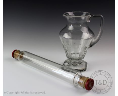 An Art Deco style water jug, decorated with a panelled lower  section, upon a canted square pedestal base, 22cm high and a vi