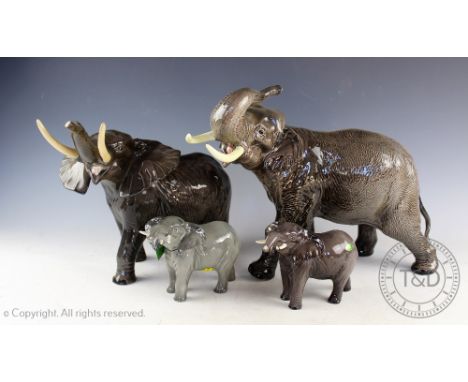 A collection of Beswick elephants comprising; model number 998, gloss, 26cm high, 2x model number 974, gloss, 12cm high and a