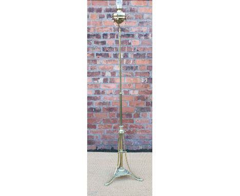 A late Victorian brass adjustable standard lamp, on foliate case tripod base, 147cm high   CONDITION REPORT:  Lighting lots a