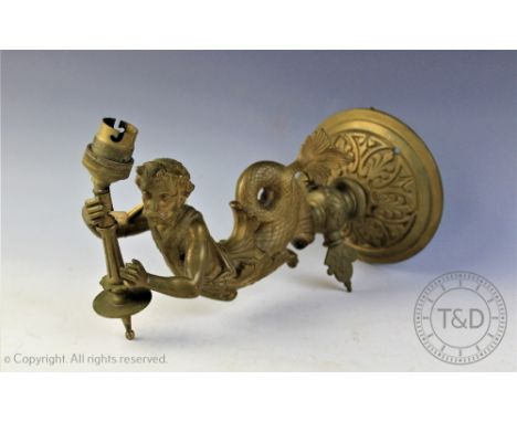 A late Victorian cast brass wall light, modelled as a merman supporting a torch, surmounted with light fitting and with shape