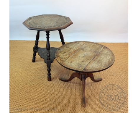 An oak circular occasional table, of low proportions, 46cm H, with a mahogany and beech tripod table and a Victorian carved o