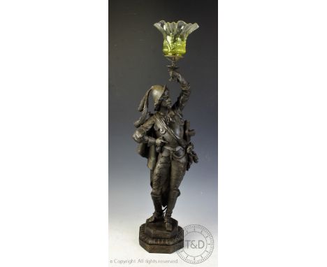 A Victorian spelter gas lamp, modelled as a cavalier on canted base, associated moulded green glass shade, 79cm to the top of