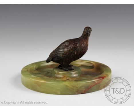 A cold painted bronze grouse, early 20th century, mounted on circular onyx base, 8.5cm high 