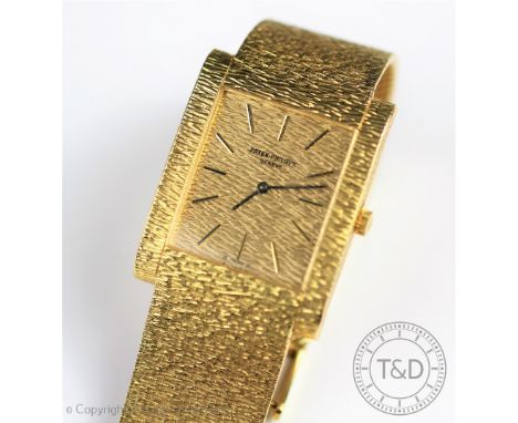 A Patek Philippe 18ct yellow gold gentlemans wristwatch, 3553/1, circa 1970, the rectangular case with textured bark effect f